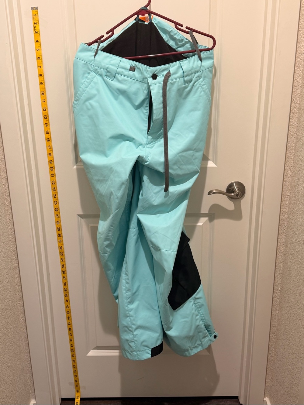 Orage Men's Aqua/Turquoise Snow Pants with Black Knee Panels.